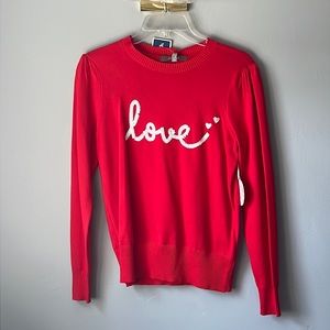 Red long sleeve tee that says love